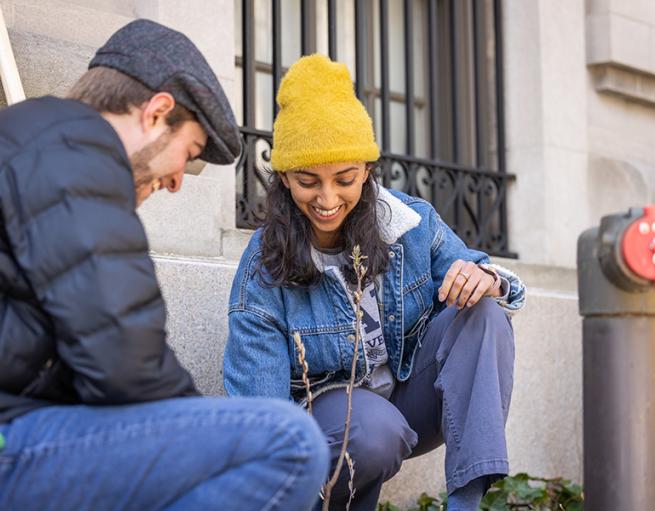 Two Yale students plant a tree on campus