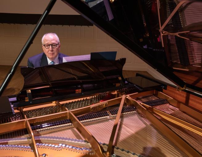 Robert Block plays a grand piano