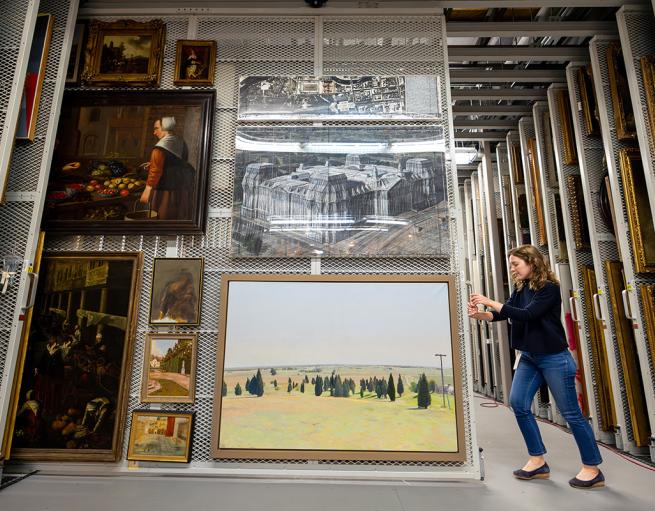 Paintings stored vertically on screens at Yale’s Library Shelving Facility in Hamden