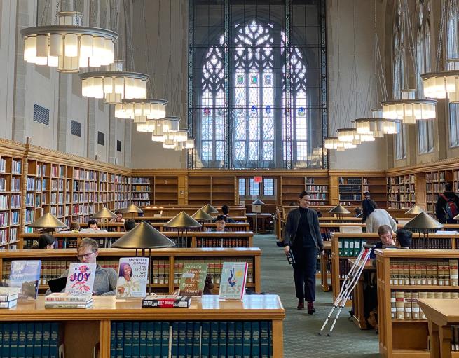 Students at work in a grand library