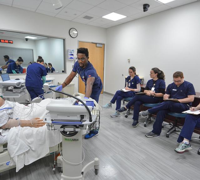 Yale Nursing students train in a simulated hospital room