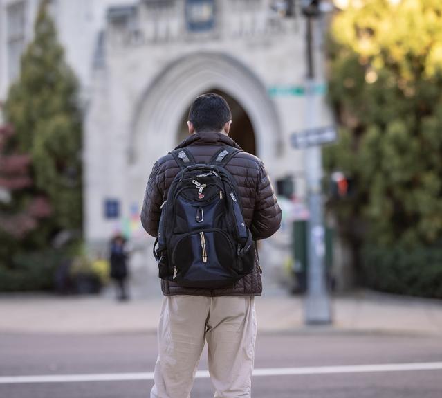 Yale student with backpack on campus