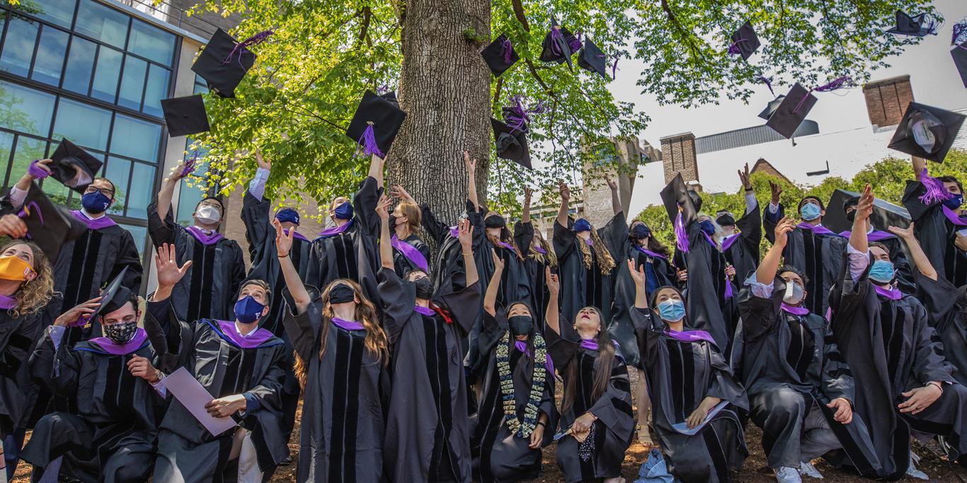 students celebrating at graduation