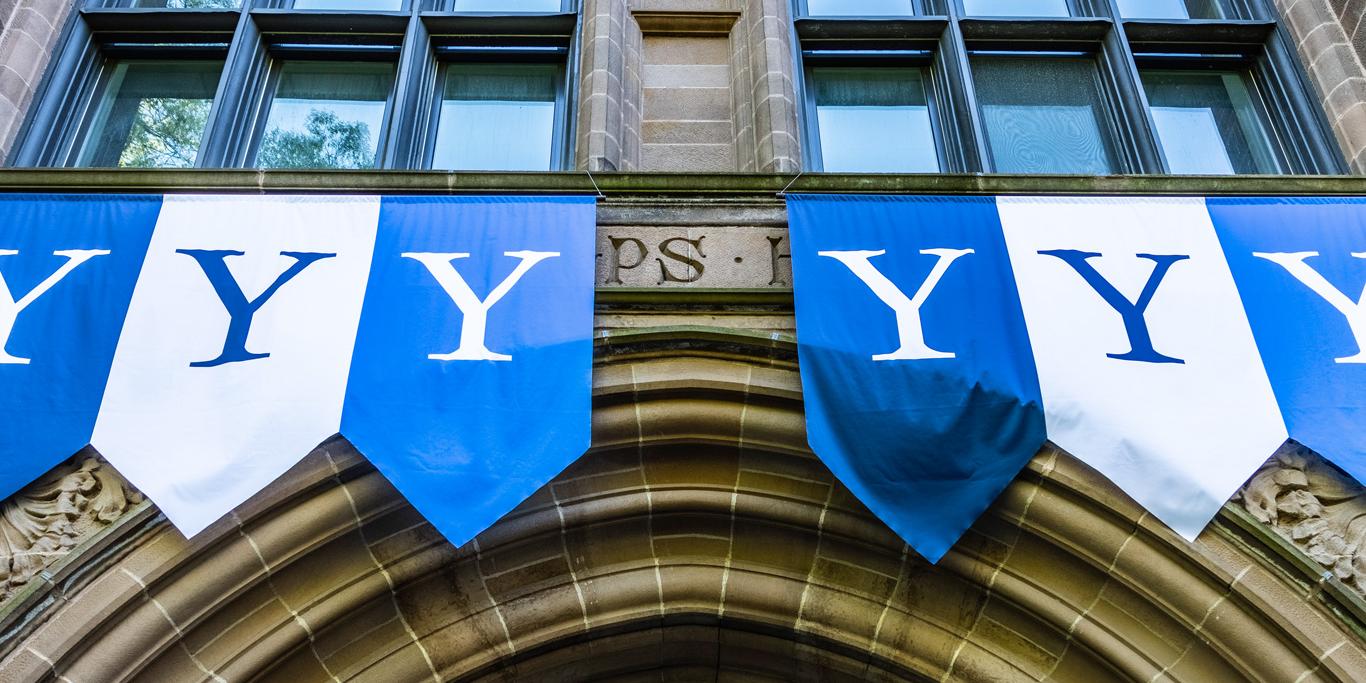 Yale banners hung on an archway entrance