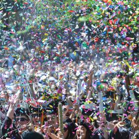 students celebrating at graduation