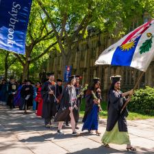 A procession of YSE graduates on commencement day