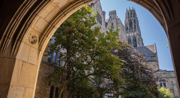 View of Harkness Tower through an archway on Yale's campus