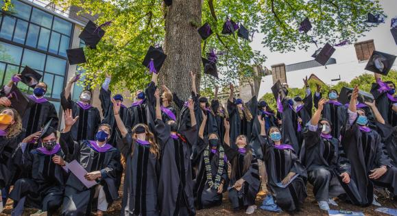 students celebrating at graduation