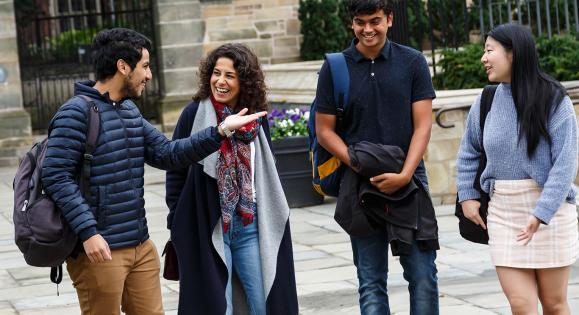 Students walk and talk together on campus