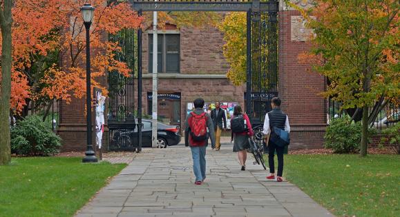 Students walking through the Noah Porter gate in the fall