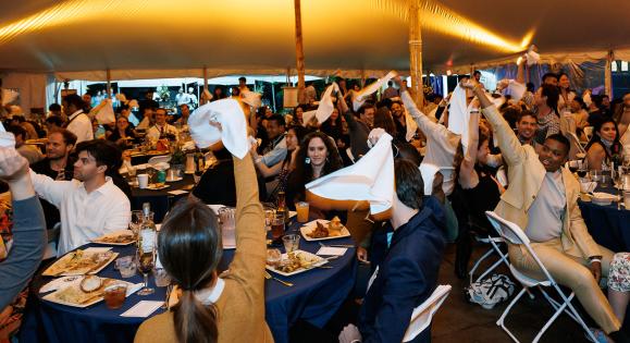 Yale alumni wave white handkerchiefs as "Bright College Years" is played