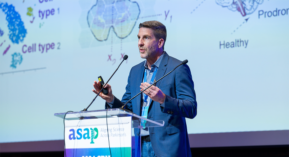 Physician and researcher Clemens Scherzer speaks from a podium