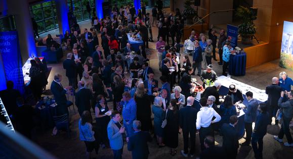A crowd of Yale alumni gathered for the For Humanity Illuminated reception at Benaroya Hall