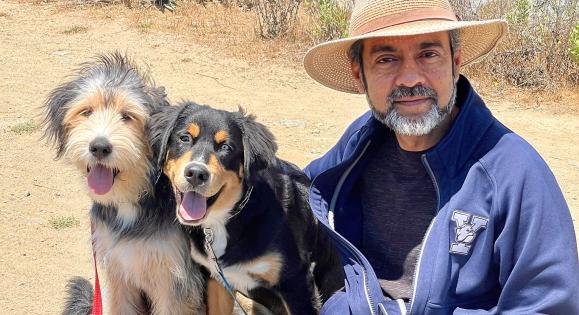 Rahul Prasad ’87 PhD with his two dogs