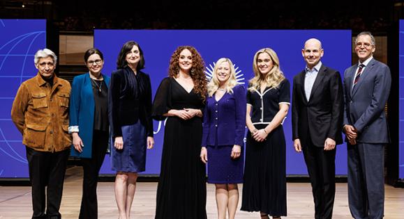 For Humanity Illuminated New York Event speakers standing together on stage