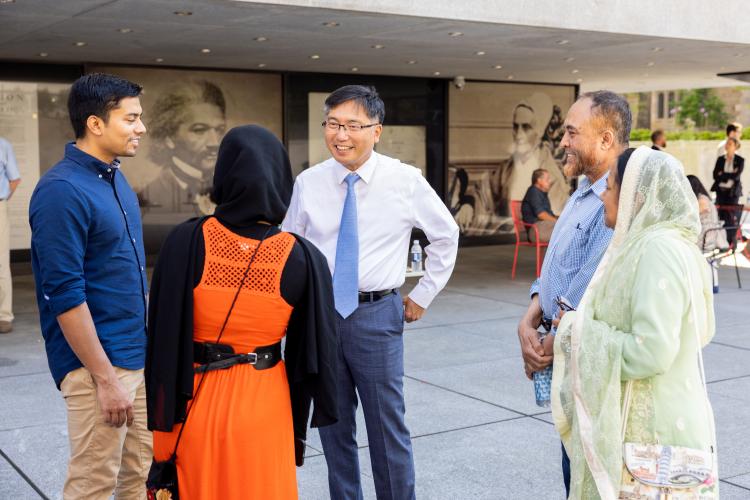 Marvin Chun talks with students and families during commencement festivities in 2022
