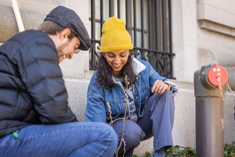 Two Yale students plant a tree on campus