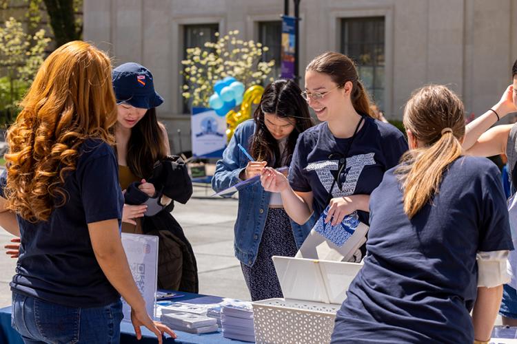 Yale students and volunteers enjoying Eli Days