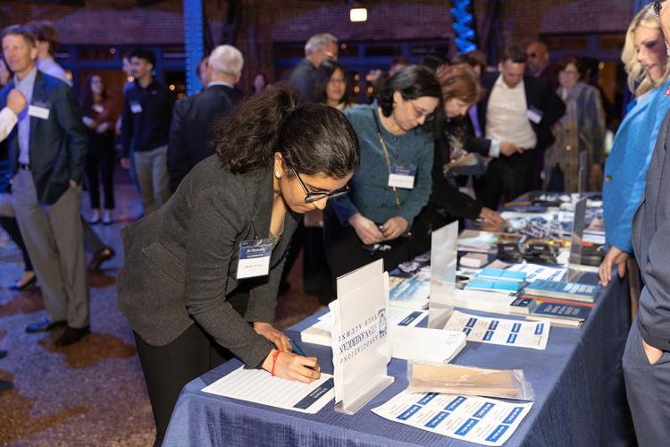 Guests mingle during the For Humanity Illuminated reception in Chicago