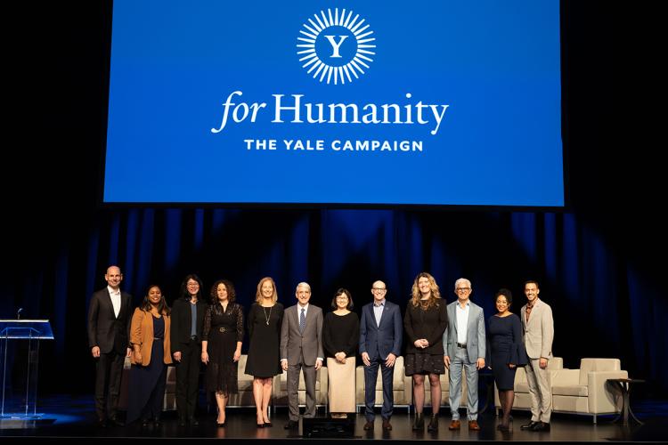 Panelists on stage at For Humanity Illuminated in NYC