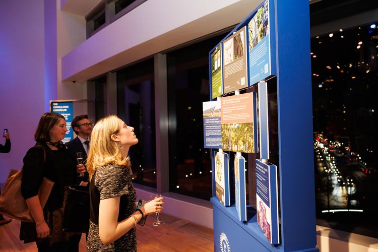 Guests explore an interactive engagement zone at For Humanity Illuminated in NYC