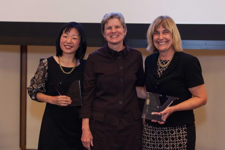 Dr. Akiko Iwasaki Ph.D. and Dr. Anna Marie Pyle, Ph.D. receiving an award, presented by Dean Nancy Brown, Ph.D.