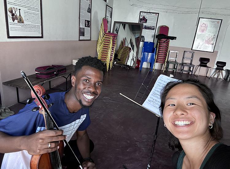 Sheeline Yu with a student during a music lesson a the Dhow Countries Music Academy